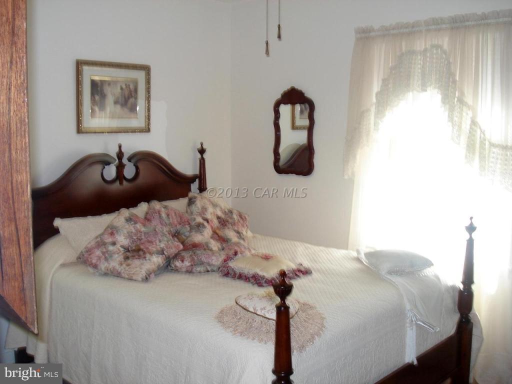 8037 Downs Road Newark, MD 21841 - Photo 22 of 23 a bedroom with a bed and a window