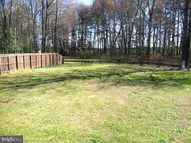 8037 Downs Road Newark, MD 21841 - Photo 5 of 23 a swimming pool with outdoor seating and yard