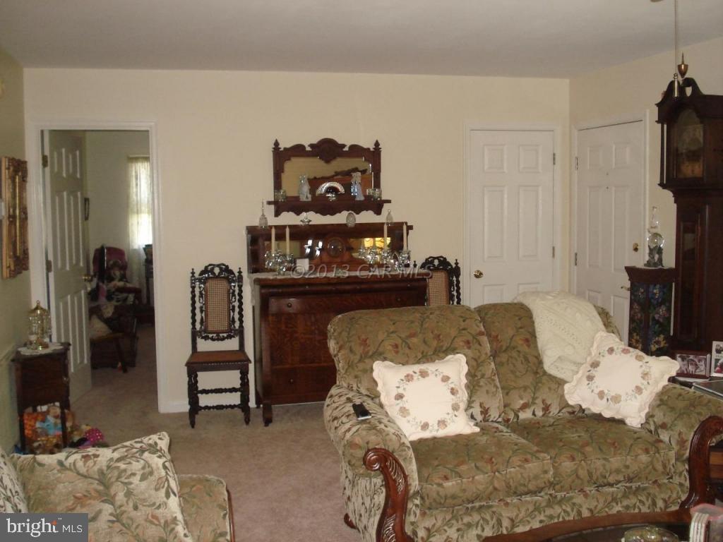 8037 Downs Road Newark, MD 21841 - Photo 9 of 23 a bed room with a bed and a television