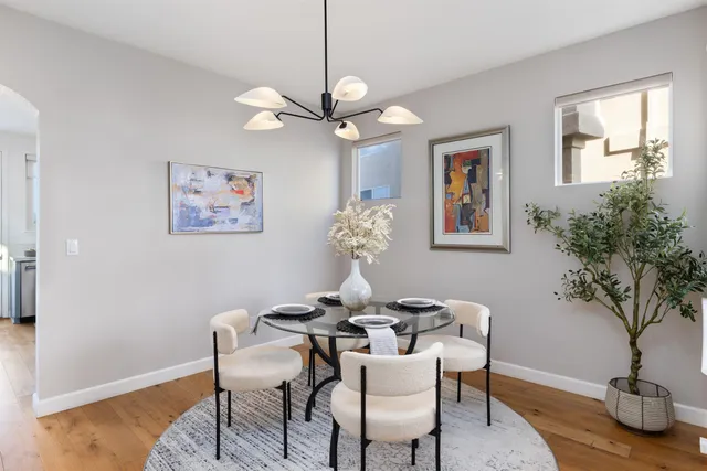 a dining room with furniture and window