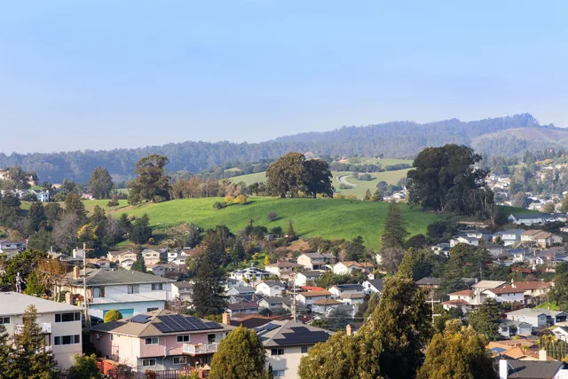 a view of a city with a lake
