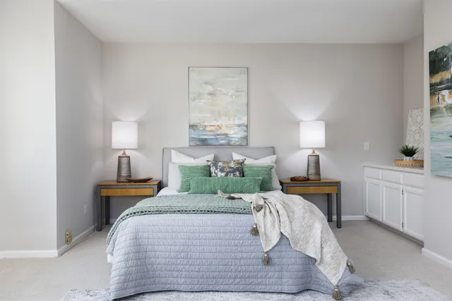 a bed room with bed and window