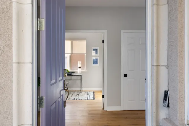 a view of kitchen with livingroom and hardwood floor