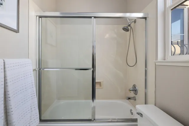 a bathroom with a bath tub and a shower