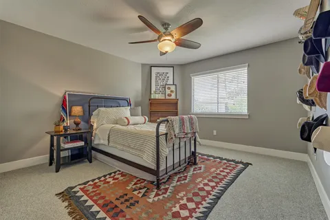 a view of a livingroom with furniture and a chandelier fan