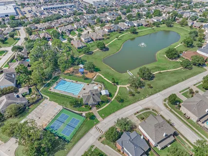 a view of a lake with a house in the background
