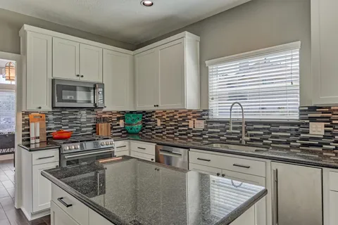 a dining room with furniture and window