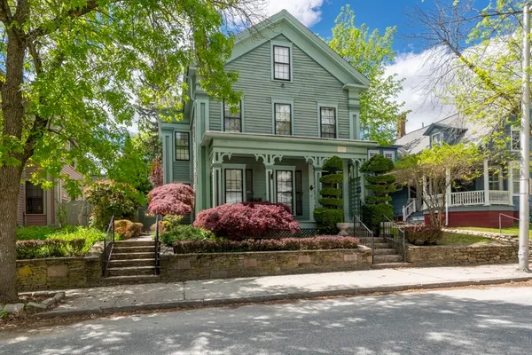 a front view of a house with garden