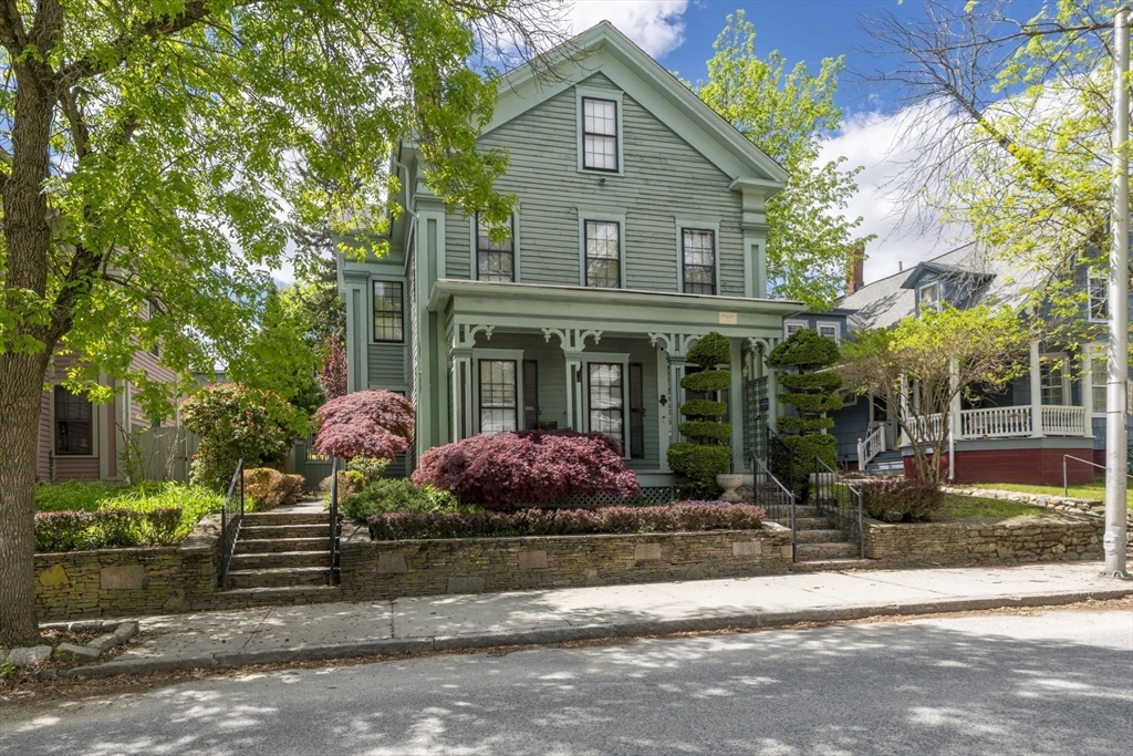 12 Crown Street Worcester, MA 01609 - Photo 1 of 42 a front view of a house with garden