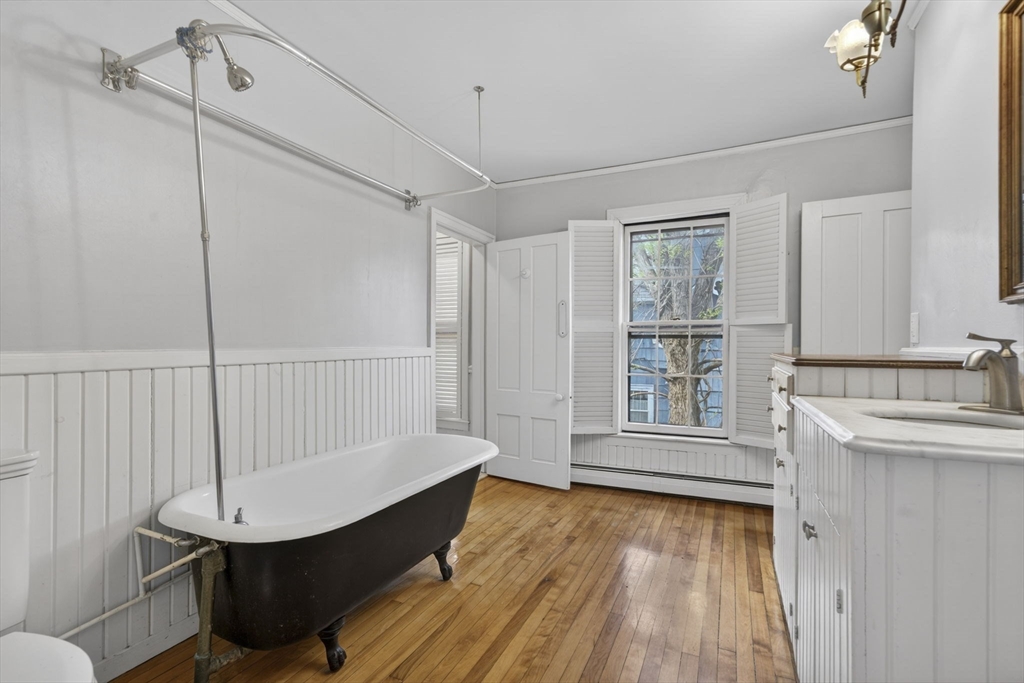 12 Crown Street Worcester, MA 01609 - Photo 22 of 42 a view of a room with wooden floor and windows