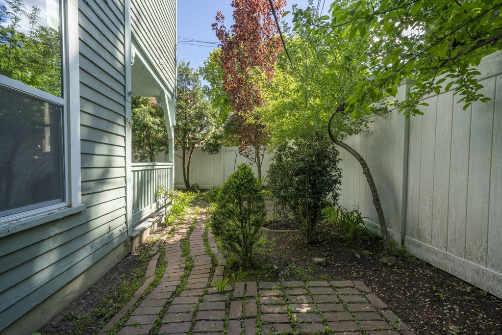 12 Crown Street Worcester, MA 01609 - Photo 38 of 42 a backyard of a house with lots of green space