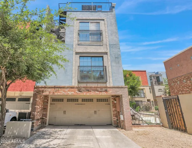 a view of a brick building with many windows