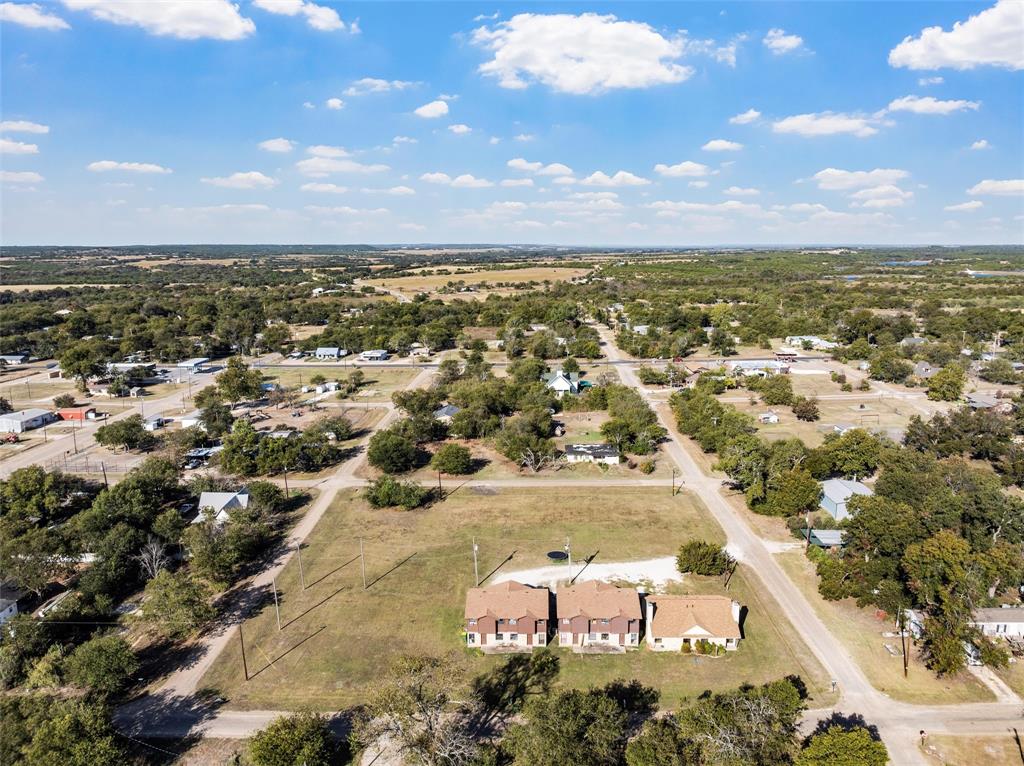 905 Shepherd Street Morgan, TX 76671 - Photo 5 of 5 an aerial view of residential houses with outdoor space
