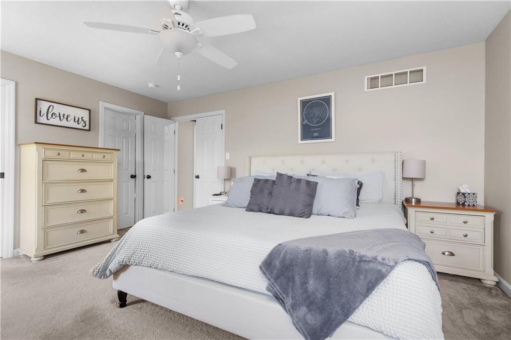 102 Castle View Drive McKees Rocks, PA 15136 - Photo 24 of 30 a bedroom with a bed and a chandelier