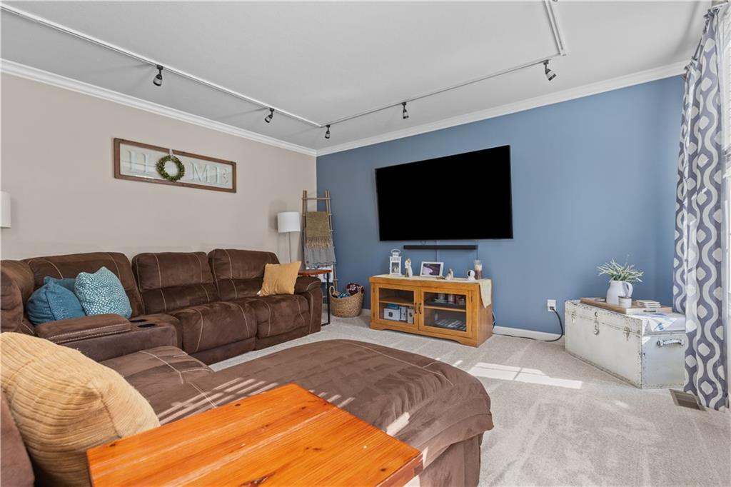102 Castle View Drive McKees Rocks, PA 15136 - Photo 5 of 30 a living room with furniture and a flat screen tv