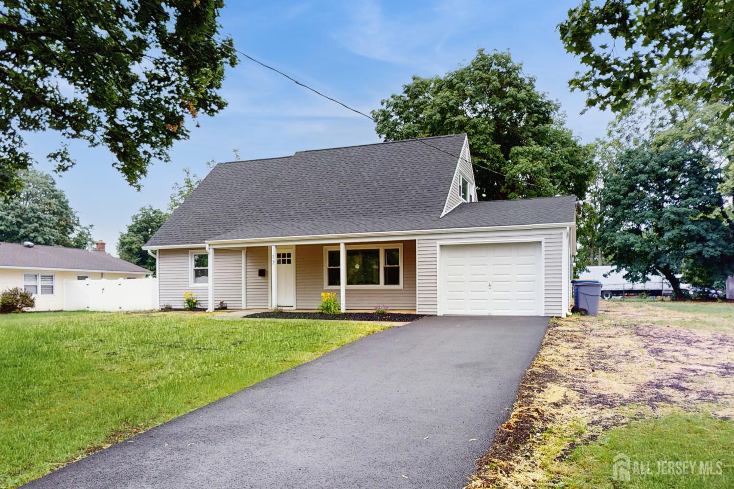 17 Tamarack Road Somerset, NJ 08873 - Photo 2 of 13 front view of a house with a yard