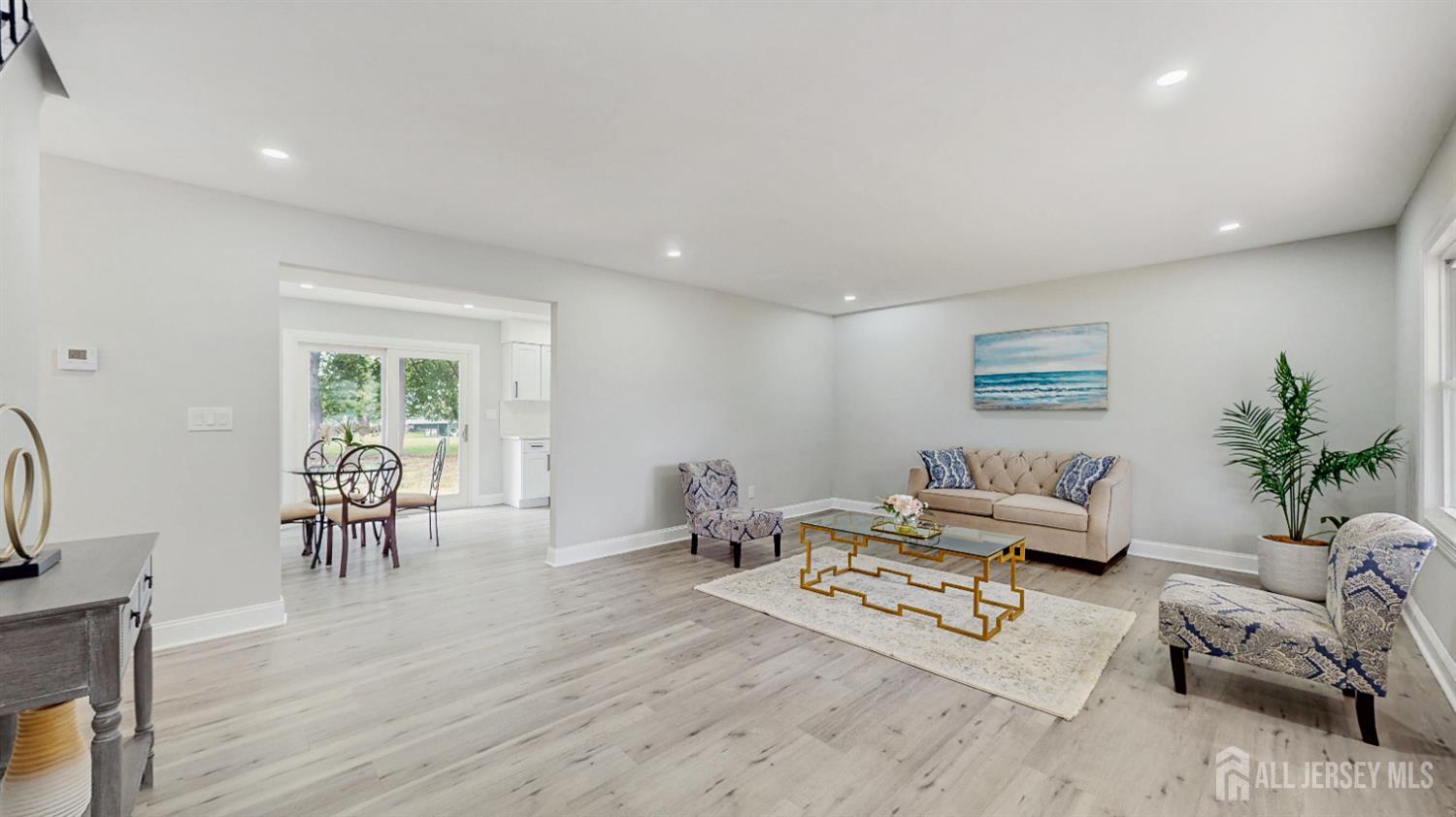 17 Tamarack Road Somerset, NJ 08873 - Photo 3 of 13 a living room with furniture and a table