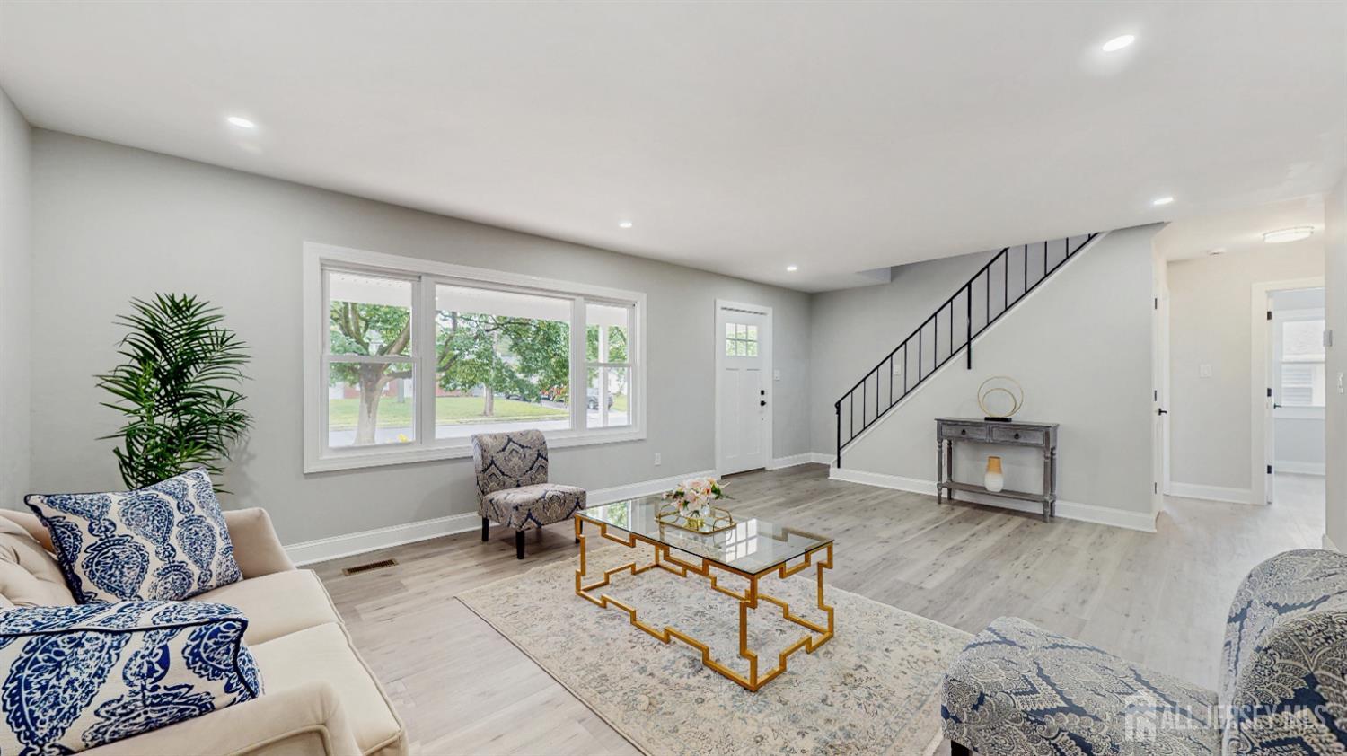 17 Tamarack Road Somerset, NJ 08873 - Photo 4 of 13 a living room with furniture and a window