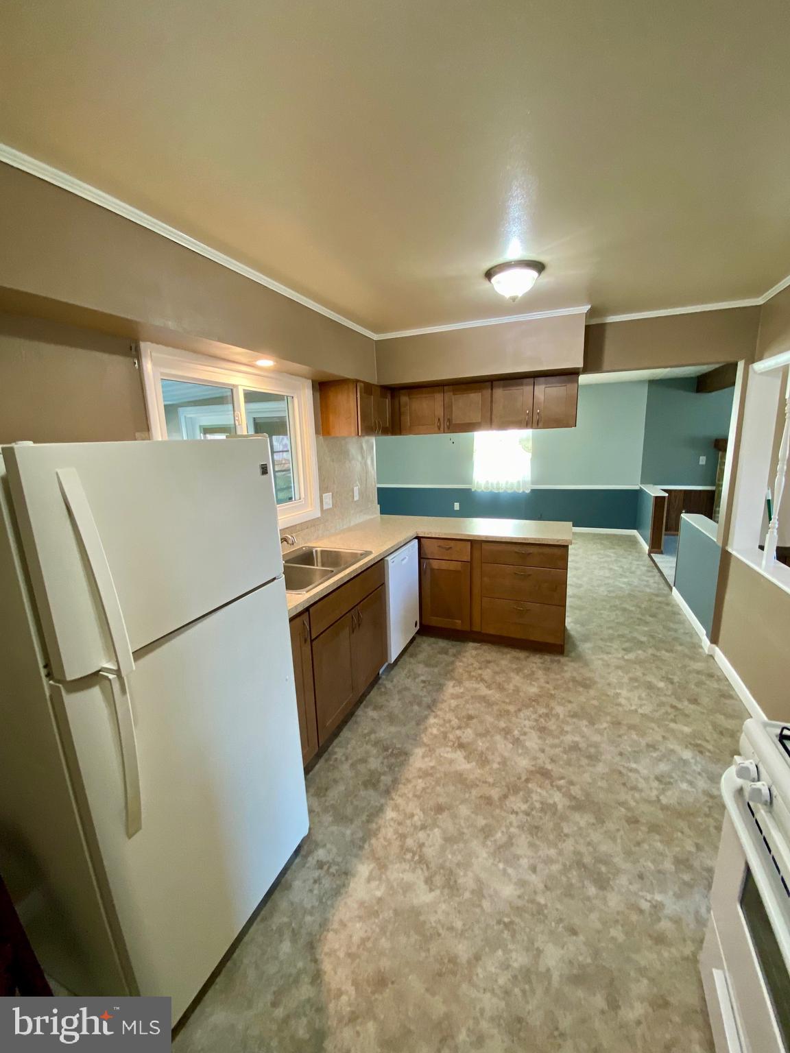 377 Juniper Lane Hanover, PA 17331 - Photo 11 of 24 a kitchen with sink cabinets and white appliances
