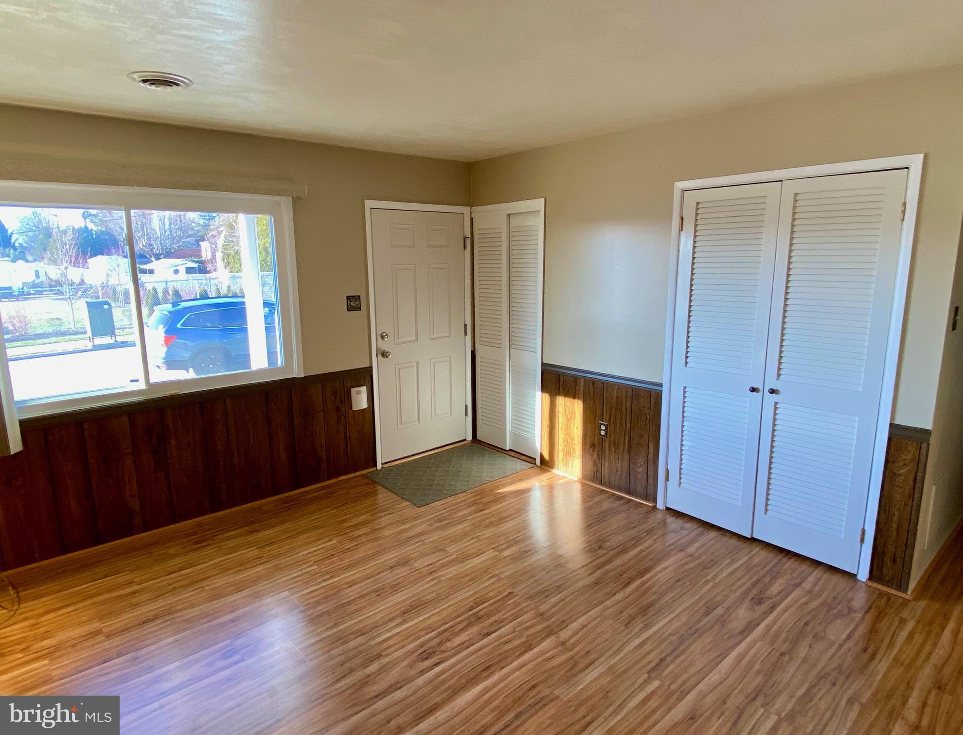 377 Juniper Lane Hanover, PA 17331 - Photo 6 of 24 a view of an empty room with wooden floor and a window