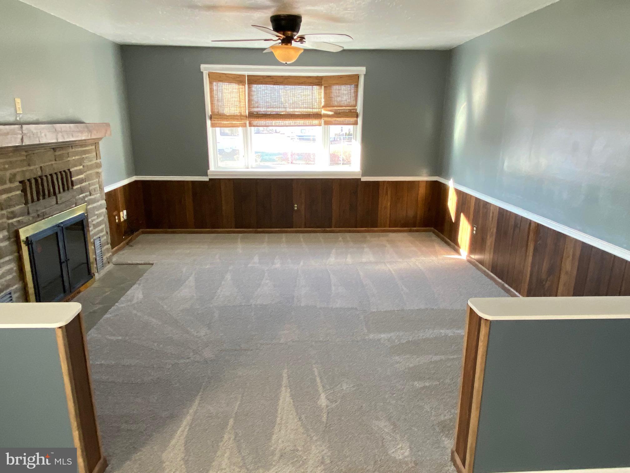 377 Juniper Lane Hanover, PA 17331 - Photo 9 of 24 a view of an empty room with a fireplace and a window