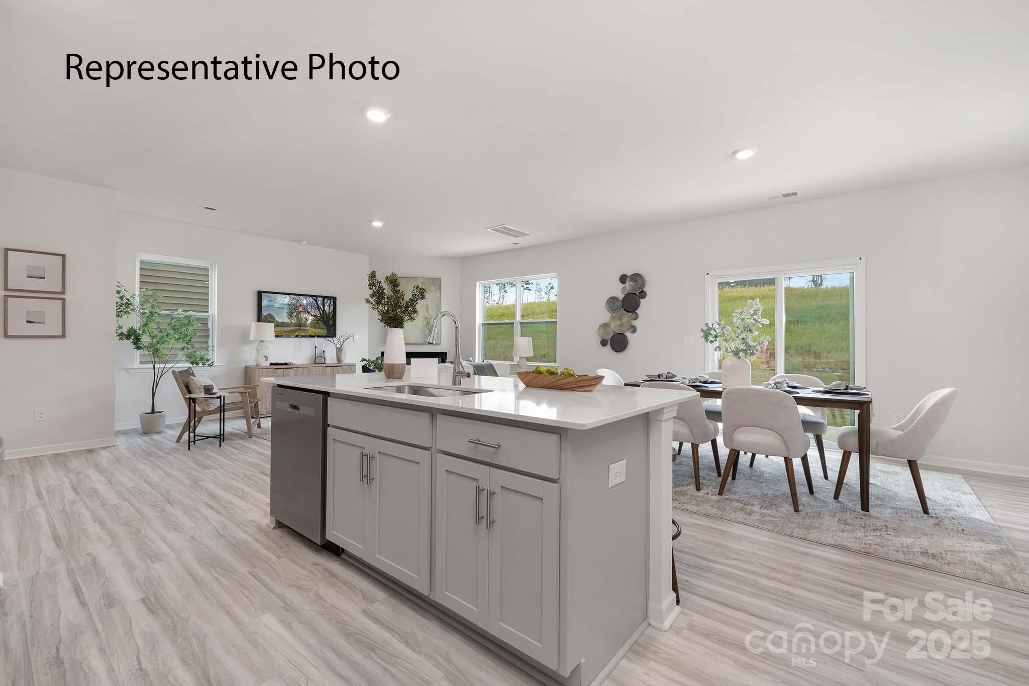 3045 Ora Smith Road Lincolnton, NC 28092 - Photo 11 of 28 a kitchen with lots of wooden furniture dining table and wooden floor