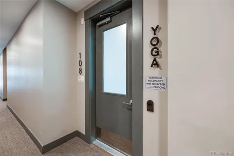 a bathroom with a shower and mirror
