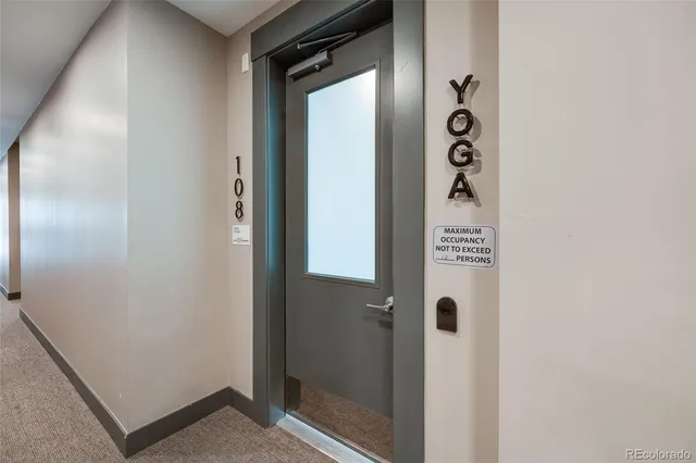 a bathroom with a shower and mirror