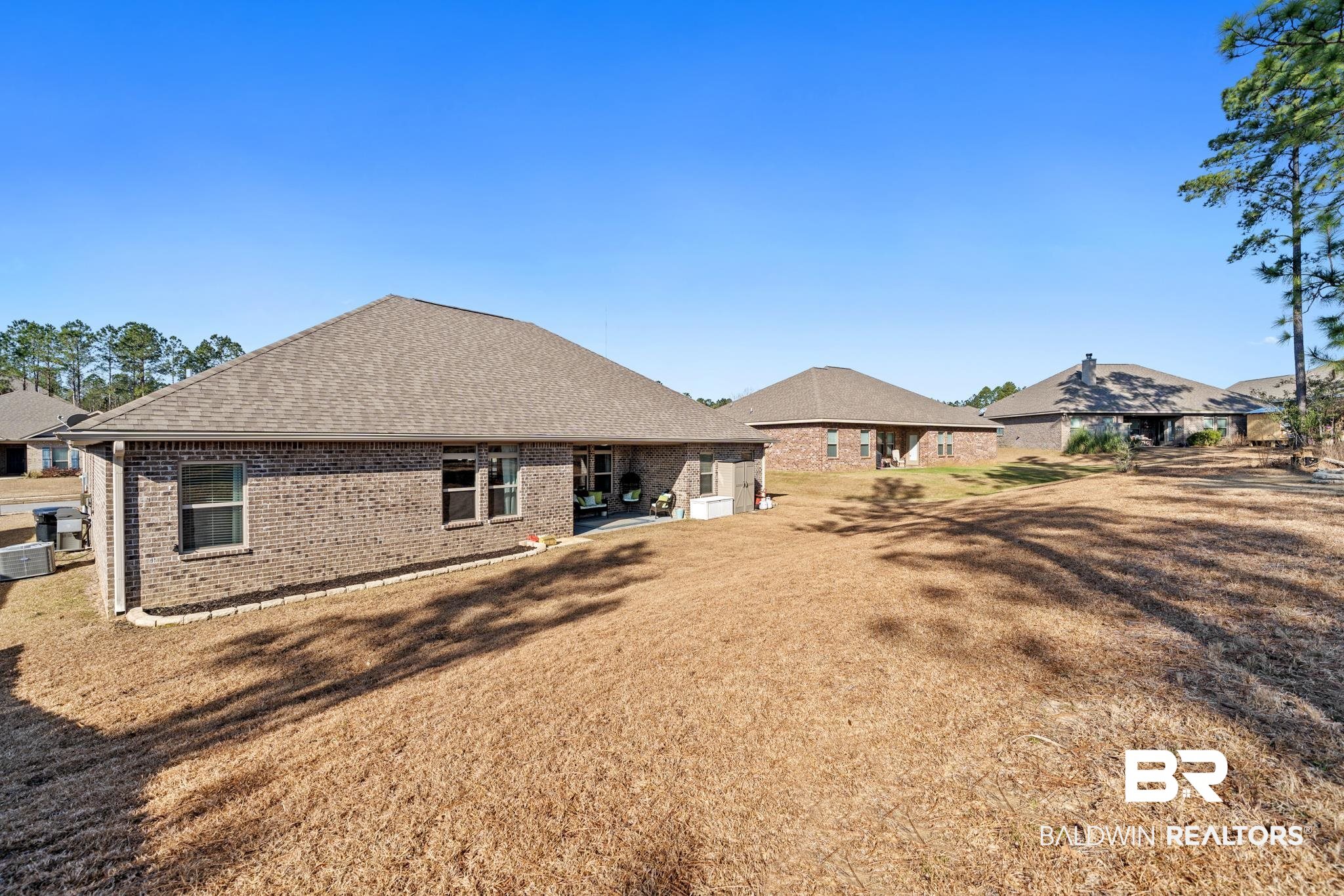 31472 Hoot Owl Road Daphne, AL 36527 - Photo 26 of 32 Back of house featuring a patio area