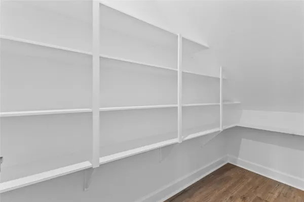 a view of a house with a big yard and a large tree