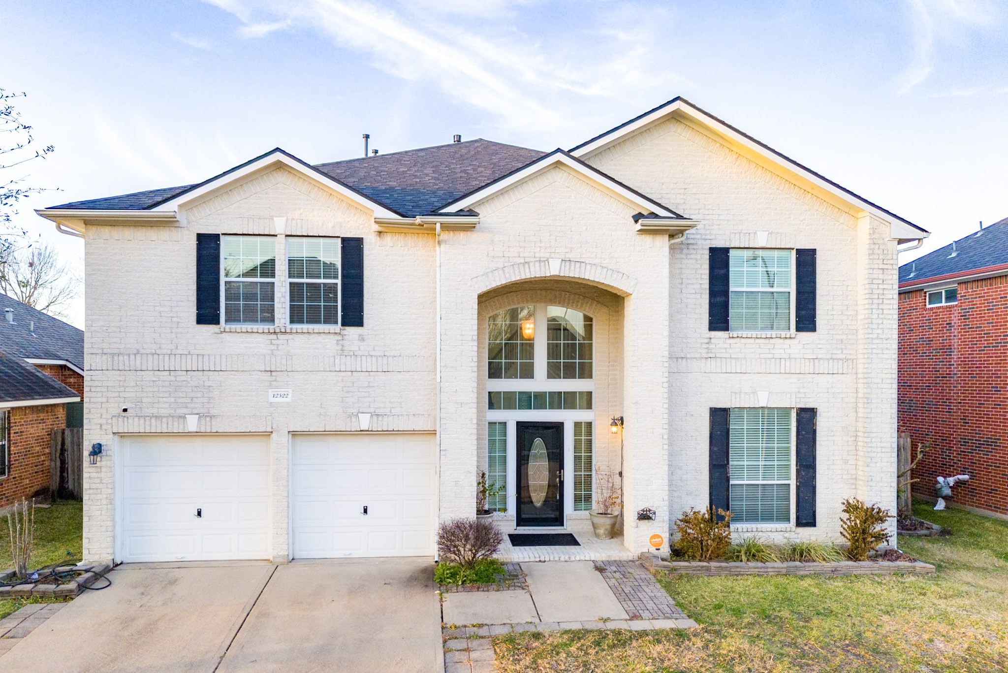 12522 East Nantucket Road Sugar Land, TX 77478 - Photo 1 of 39 a front view of a house with a yard and garage