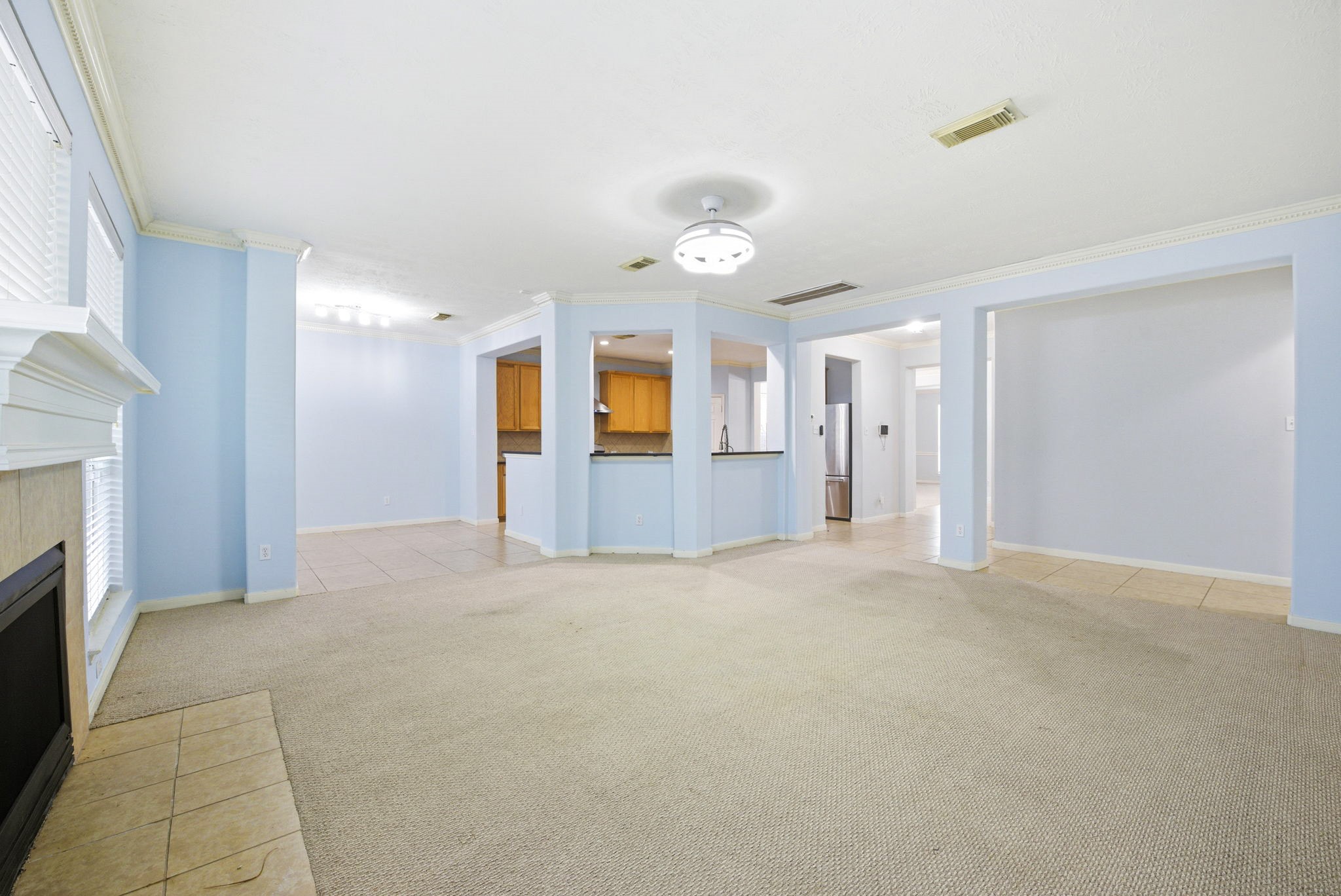 12522 East Nantucket Road Sugar Land, TX 77478 - Photo 18 of 39 a view of an empty room with a fireplace and window