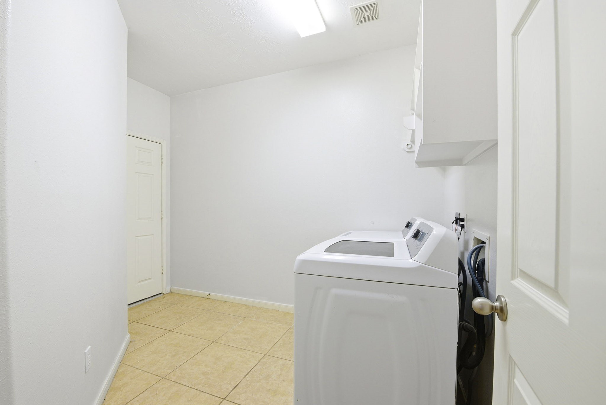 12522 East Nantucket Road Sugar Land, TX 77478 - Photo 19 of 39 a utility room with dryer and washer