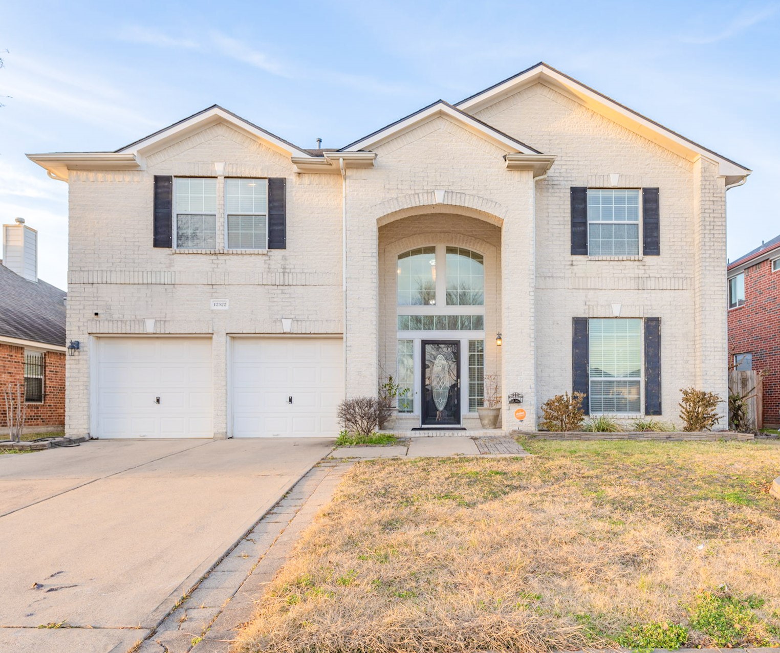 12522 East Nantucket Road Sugar Land, TX 77478 - Photo 2 of 39 a front view of a house with a yard