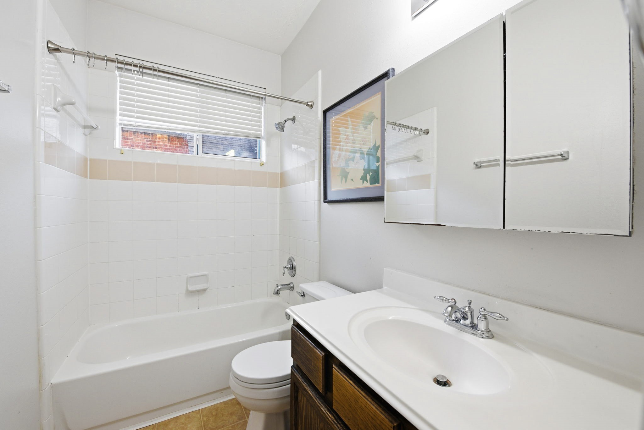 12522 East Nantucket Road Sugar Land, TX 77478 - Photo 22 of 39 a bathroom with a sink a toilet and a bathtub