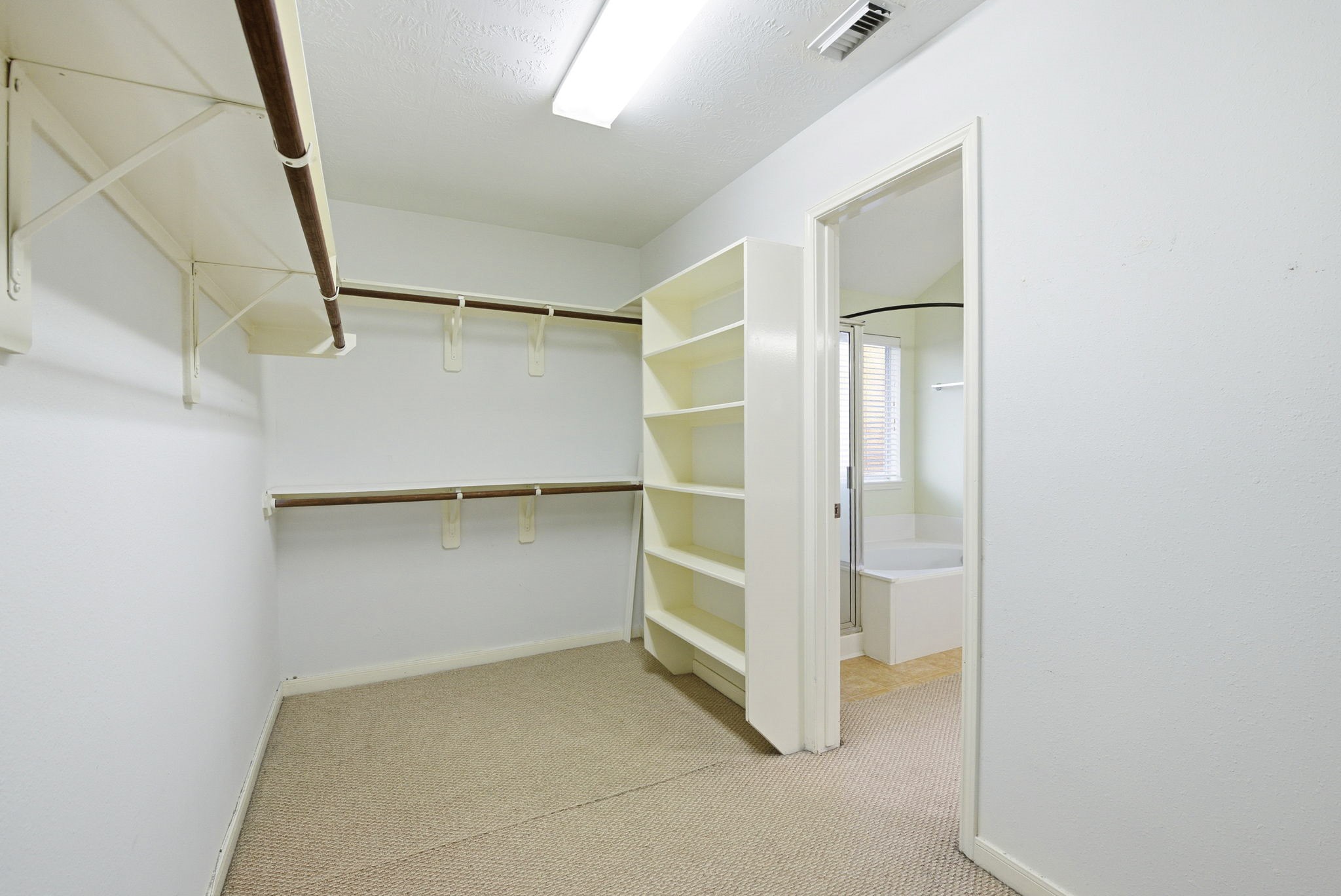 12522 East Nantucket Road Sugar Land, TX 77478 - Photo 29 of 39 a view of an empty walk in closet