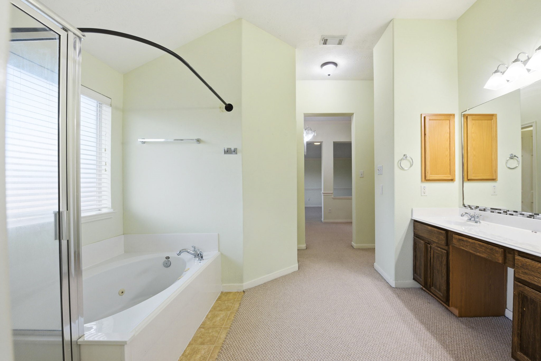 12522 East Nantucket Road Sugar Land, TX 77478 - Photo 30 of 39 a bathroom with a tub sink shower and mirror