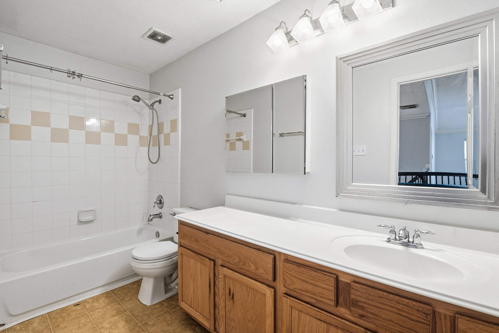 12522 East Nantucket Road Sugar Land, TX 77478 - Photo 33 of 39 a bathroom with a sink a toilet and a bathtub