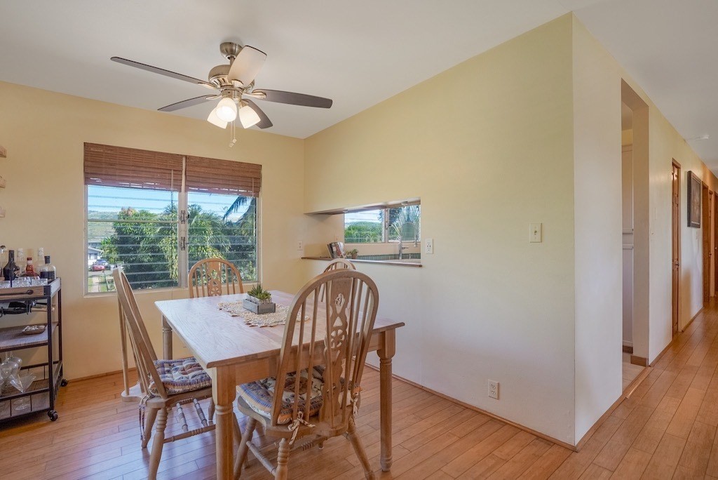 8520 Elepaio Road Kekaha, HI 96752 - Photo 11 of 30 a view of a dining room with furniture window and wooden floor