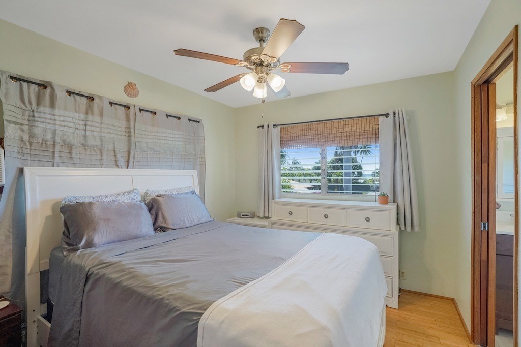 8520 Elepaio Road Kekaha, HI 96752 - Photo 14 of 30 a bedroom with a large bed and a window