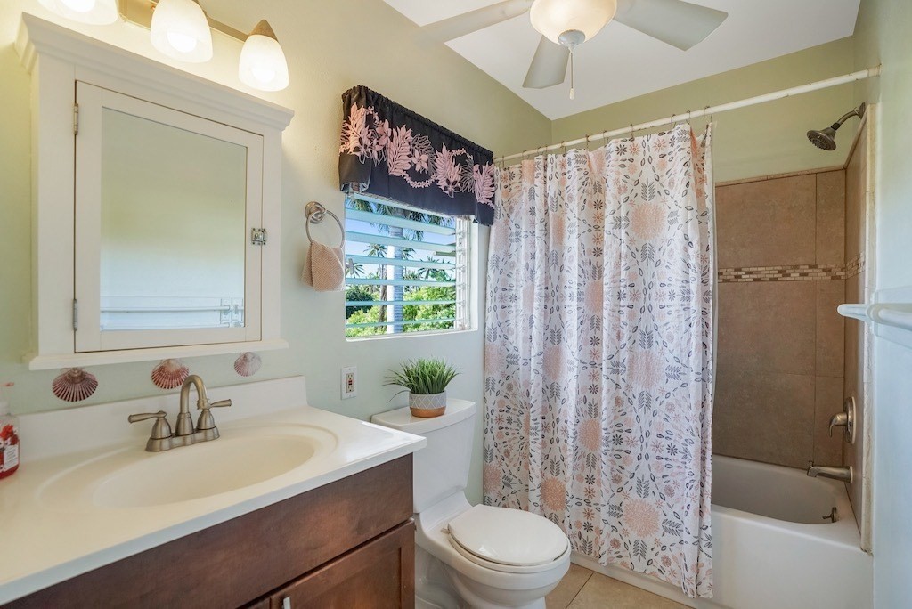 8520 Elepaio Road Kekaha, HI 96752 - Photo 16 of 30 a bathroom with a sink toilet a mirror a vanity and shower