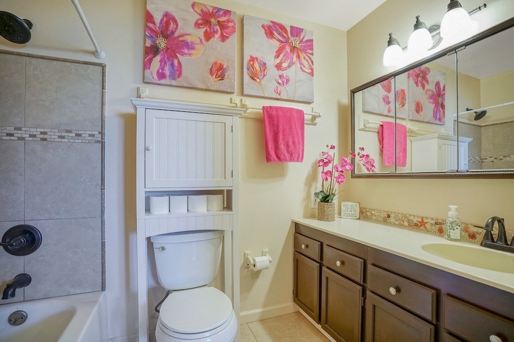 8520 Elepaio Road Kekaha, HI 96752 - Photo 20 of 30 a bathroom with a toilet sink and mirror