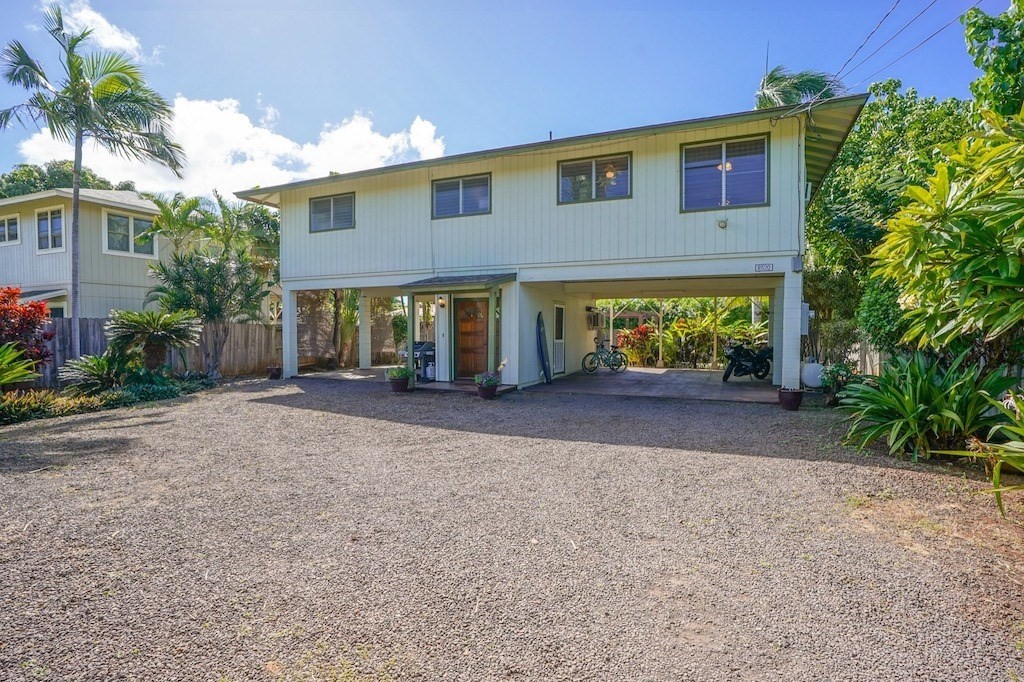 8520 Elepaio Road Kekaha, HI 96752 - Photo 2 of 30 a front view of a house with garden