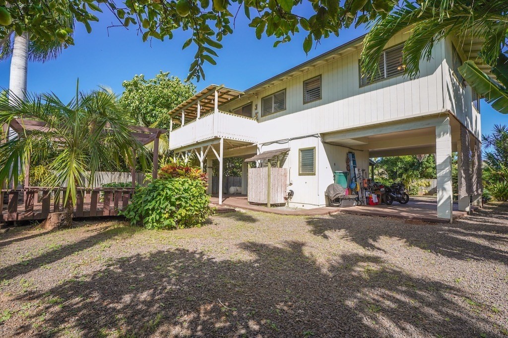 8520 Elepaio Road Kekaha, HI 96752 - Photo 26 of 30 a view of a white house with a large tree