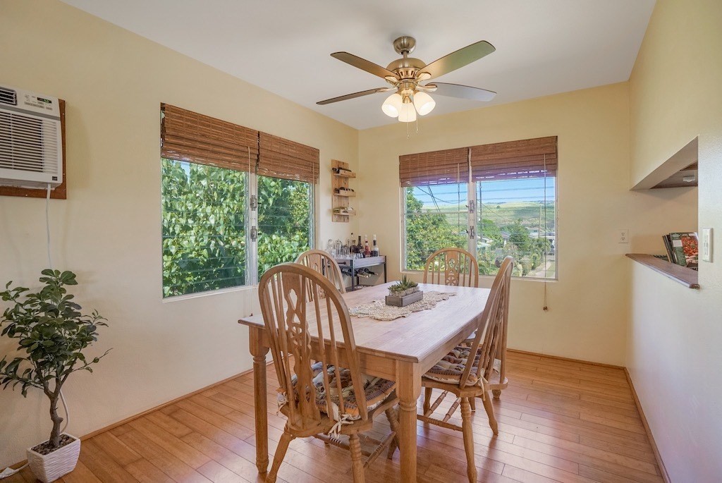 8520 Elepaio Road Kekaha, HI 96752 - Photo 10 of 30 a view of a dining room with furniture window and wooden floor