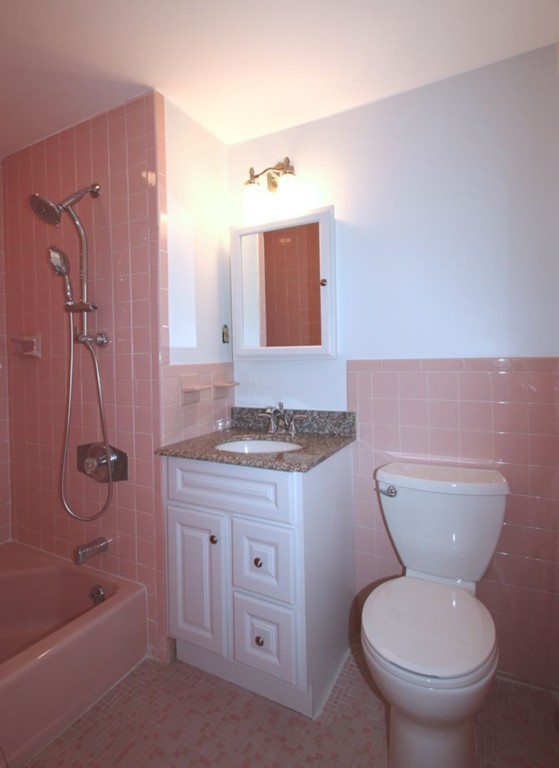 23 Campbell Road Wayland, MA 01778 - Photo 14 of 24 a bathroom with a granite countertop toilet sink and mirror