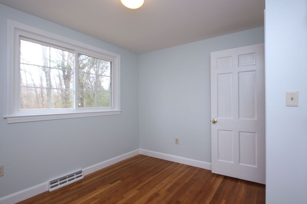 23 Campbell Road Wayland, MA 01778 - Photo 16 of 24 a view of empty room with wooden floor and fan