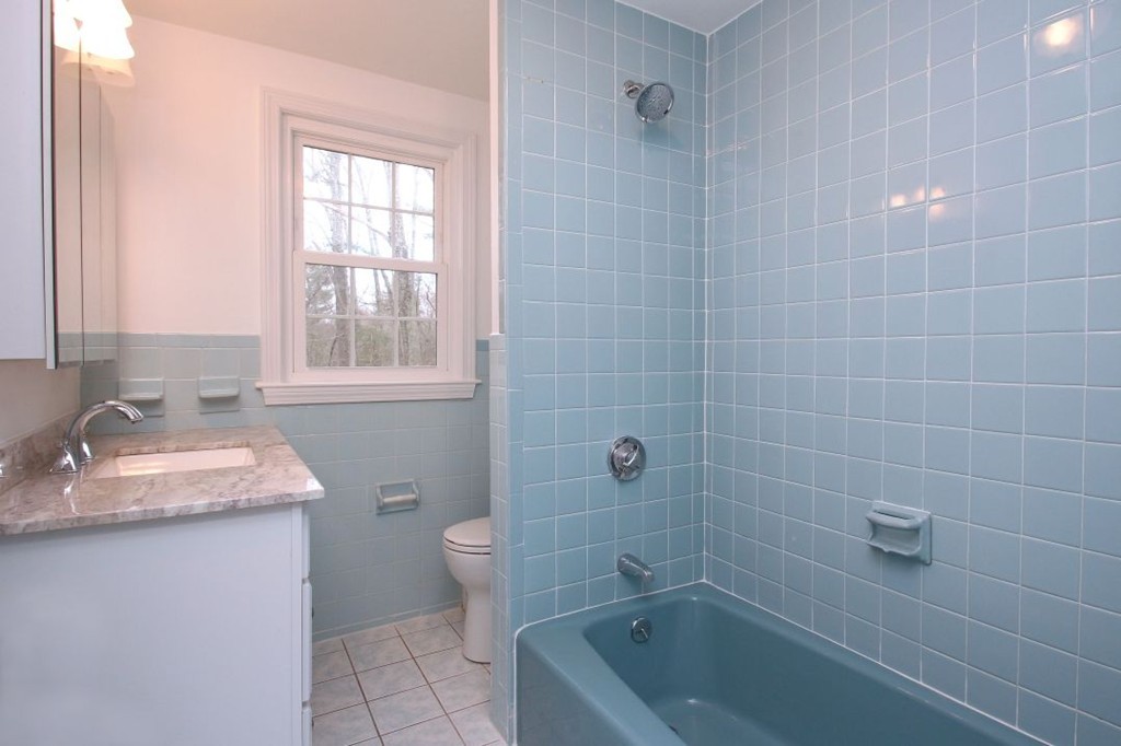 23 Campbell Road Wayland, MA 01778 - Photo 18 of 24 a bathroom with a granite countertop sink a toilet and bathtub