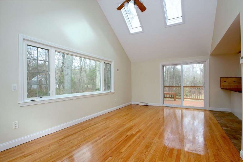 23 Campbell Road Wayland, MA 01778 - Photo 7 of 24 a view of an empty room with wooden floor and a window