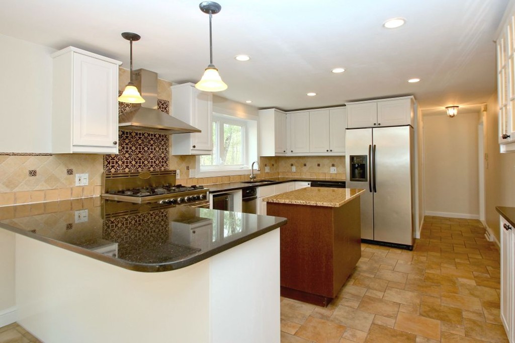 23 Campbell Road Wayland, MA 01778 - Photo 10 of 24 a kitchen with stainless steel appliances granite countertop a sink a refrigerator and a stove